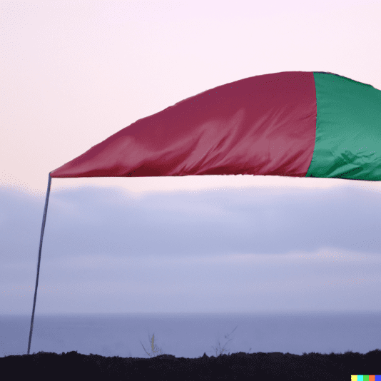 DALL·E 2022-08-23 09.12.08 - slightly torn half-red half-green windward pennant on a dirt mound in front of the line between sky & sea at dusk